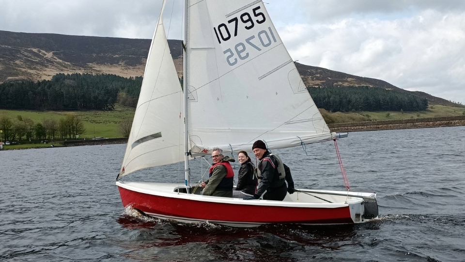 Andrew Redrup, Freya Redrup and David McKee enjoy the sailing experience