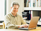 image of man using a laptop