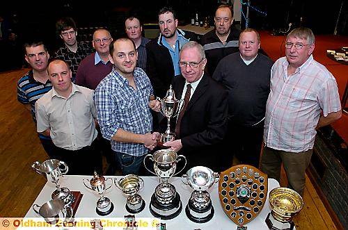 WINNERS in the Failsworth Bowls League are pictured at their presentation evening at Stanley Road Conservative Club, Chadderton. In the foreground, Dave Thornley (left) collects the President’s Trophy from league president Frank Lees. 