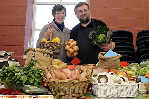 FRESH produce and an array of Christmas goodies tempted shoppers at a farmers’ market at Denshaw Village Hall. Diane and Herbie Davies show off their fruit and veg. 