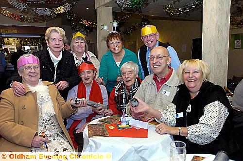 Pictured with crackers and hats are (from the left, back) Greta Cheetham, Marilyn Hewitt, Christine Burgess, Glynne Palmer, (front) Lilian Ogden, Shirley Rogerson, June Higgs, Roy Rogerson and Joan Palmer. 