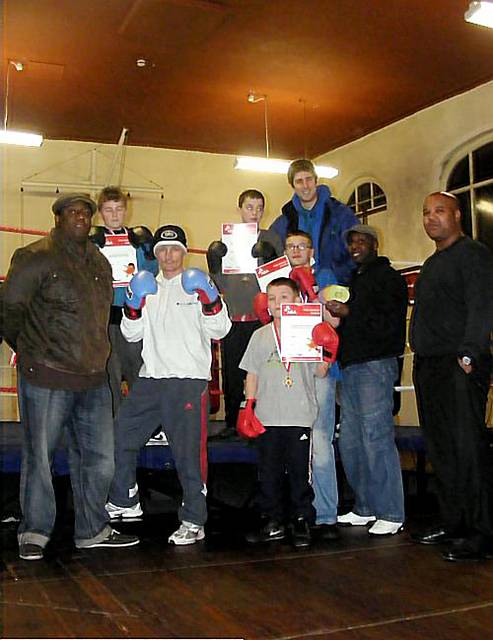 THE youngsters are pictured with Bing Findlater (left), of Positive Steps Oldham, Ashley Hall from Groundwork (top), DJ Barry Blades (second right) and Eric Noi, of Oldham Boxing (right) 
