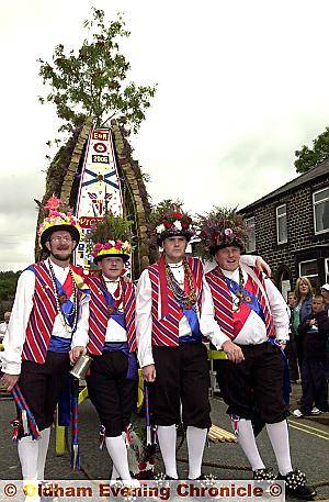 IN full swing . . . the Saddleworth Morris Men get into line for the annual Rushcart festival, from left, Ron Yates, his son David Yates, Paul Hankinson and his dad Squire Richard Hankinson 