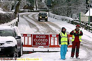 NO WAY THROUGH . . . Oldham Mountain Rescue Team volunteers staffed the A635 Isle of Sky Road at Greenfield to warn drivers the trans-Pennine link was closed 
