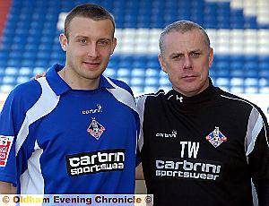 NEW SIGNING Ian Westlake is welcomed to Athletic by coach Tommy Wright. 