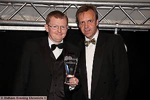 BUSINESS OF THE YEAR: Mike Braddock, Chief Executive of Secure Options, with David Meredith, Development Director at sponsors Royal Bank of Scotland 