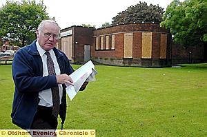 GET IT LISTED . . . Michael Lawson , from Chadderton Historical Society, outside Broadway Library which is in danger of being demolished.