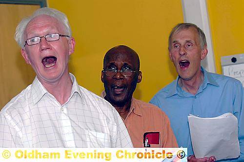 RAISING their voices . . . some of the choir members rehearsing the song 
