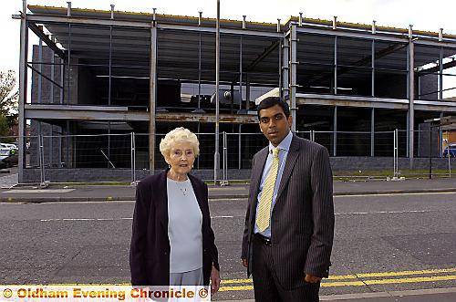 Royton North councillor Olwen Chadderton and councillor Mohib Uddin, cabinet member for Regeneration, outside the frame of Royton Assembly Hall. 