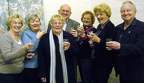 Pictured toasting success are, left to right: Pat Lord, Kath Angove, Councillor Val Sedgwick, chairman Bob Hoath, Councillor Barbara Beeley, Enid Firth and Councillor Brian Lord. 
