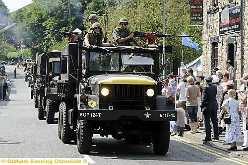 A CONVOY of military vehicles rumbles through Uppermill during last year’s Wartime Weekend in Uppermill 