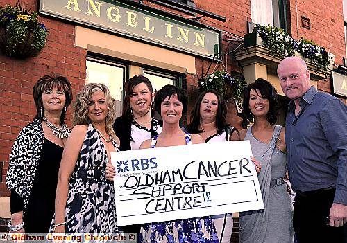 CHARITY cheer . . . presenting the cheque to Chris Hoyle of Oldham Cancer Support Centre are, from left, Beverley Heap, Sara Wrigley, Fiona Southall, Diane Bridgewater, Rachael McGhee and Andrea Derbyshire 
