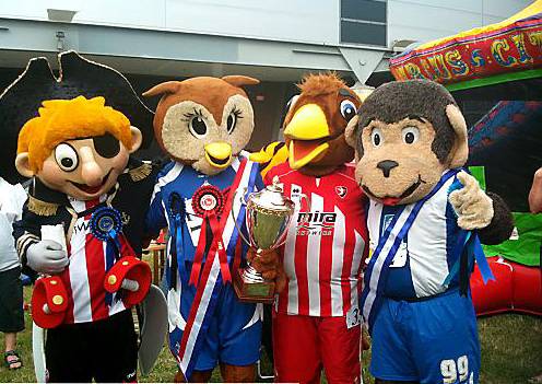 WHAT A HOOT: Chaddy is congratulated by his fellow mascots. 