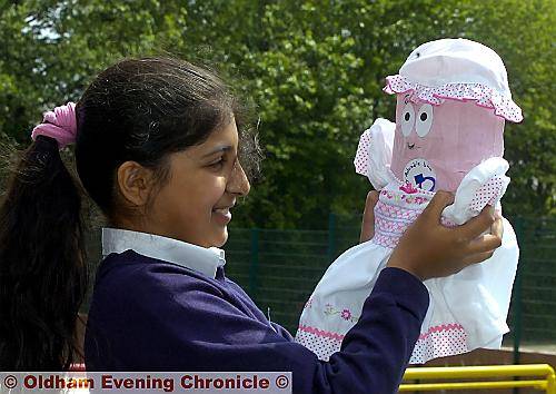 DOTING “mum” Zanab Khan (11) with her bag-of-flour baby Isha. 