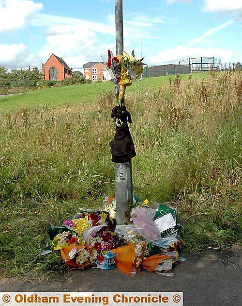 TRIBUTES . . . flowers left at the spot where Adam was fatally injured 