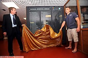 MEMBERS OF THE BOARD: Jamie Edwards (left) and Kevin Sinfield perform the unveiling ceremony at Oldham Sports Centre. 