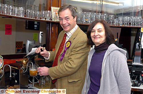 UKIP leader Nigel Farage pulls a pint with Royal Oak landlady Lynda Sweeney 