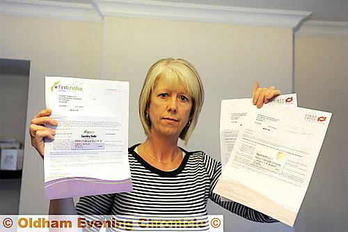 THREE times the pain . . . Helen Longley with the rent cards sent out by First Choice Homes 