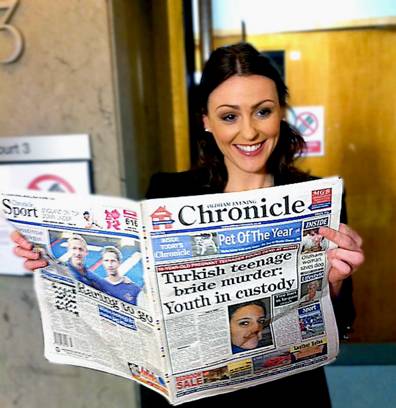 WELL read . . . Suranne (right) holds up a specially-produced copy of the Oldham Evening Chronicle. 
