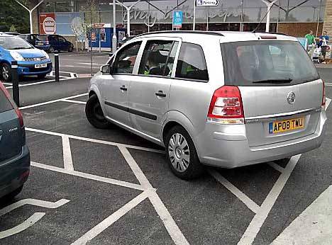 HYPOCRITICAL . . . the parking warden’s car in a disabled bay at Tesco Greenfield 
