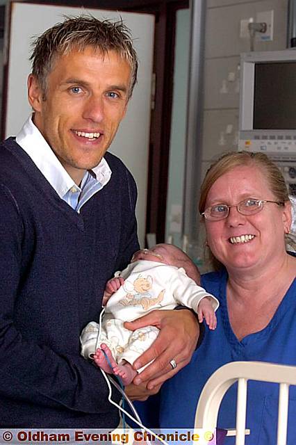HEALTHY START: Phil Neville with staff nurse Susan Davey and three-month-old Harry Wilkinson. 