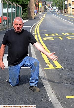 End of the line: David Marsh says his protest means the double yellow lines don’t reach the end of the road 
