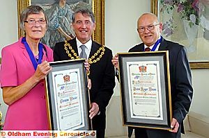 CIVIC pride... Oldham Mayor Councillor Richard Knowles, centre, presents the framed certificates to Honorary Alderman Christine Wheeler and David Jones. 
