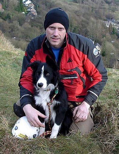 OLDHAM Mountain Rescue Team leader Mick Nield with his dog, Bob 
