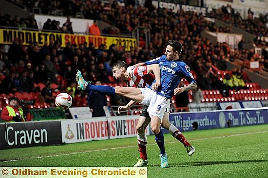 GET BACK: Athletic forward Matt Derbyshire attempts to nick the ball away from his Doncaster Rovers rival. 