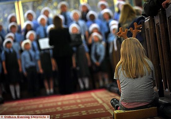 BEST seat in the house: Ellen Earnshaw watches East Crompton St James School from the aisle. Pictures: Darren Robinson 
