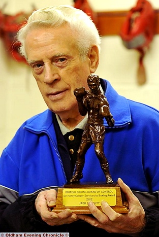 PROUD: boxing coach Jack Doughty with the Sir Henry Cooper Service to Boxing Award.  