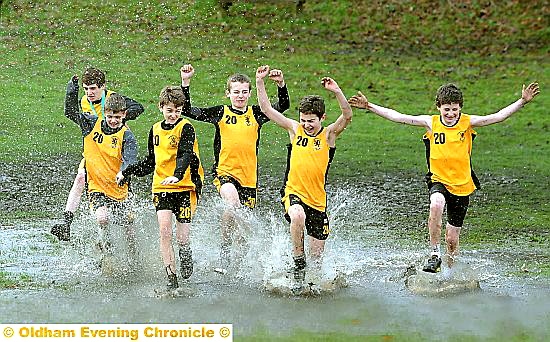 WATER WONDERLAND: Crompton House Year Eights celebrate winning their section bytaking to the water — in a large puddle! 