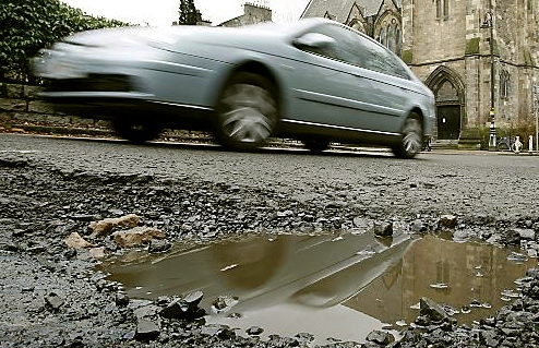 fewer potholes - but there are still many thousands of them, report says  
