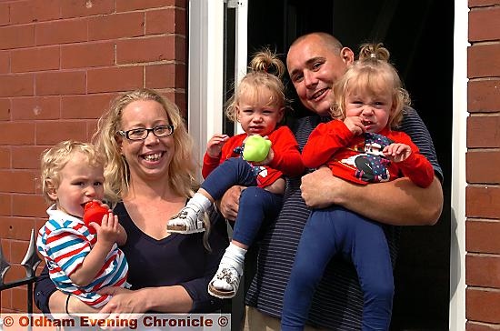 HOME sweet home: (right) Rebecca and Stephen with triplets (from left) Archie, Grace and Isabelle outside their newly-renovated home 
