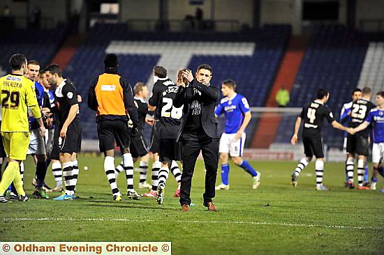 pain game . . . manager Lee Johnson salutes the fans after Latics were beaten on penalties in the Northern area semi-final of the Johnstone’s Paint Trophy last night.