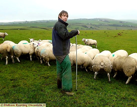 LIVELIHOOD threatened ... Farmer Darren Hough with his sheep. 

