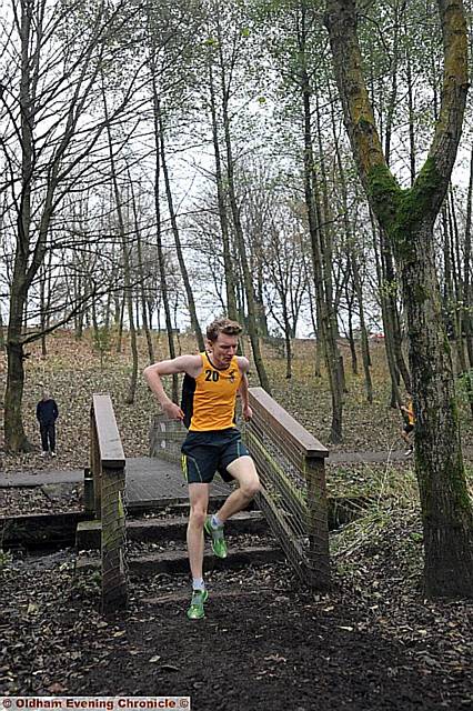 STEP ON IT: Chris Brown (above), of Crompton House, negotiates the Chadderton Hall Park course on his way to victory in the Years 10-11 race, and pictured inset with his four senior boys Oldham Schools Cross-Country titles. 
