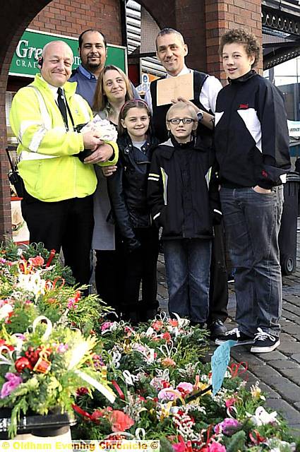 Leanne Garforth and her children, Kaitlyn ( 9 yrs ) Tyler ( 8 yrs ) and Lewis ( 14 yrs ) with Olwyn Street, Shabaz Muzaffer ( trader ) and Dave Sansome outside the Market Hall 
