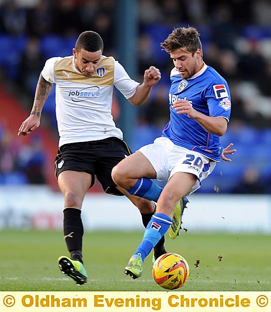 UNDER CONTROL: Mike Petrasso (right) shields the ball against Colchester. 

