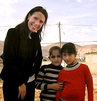 REACHING out . . . Debbie Abrahams makes friends in the West Bank 