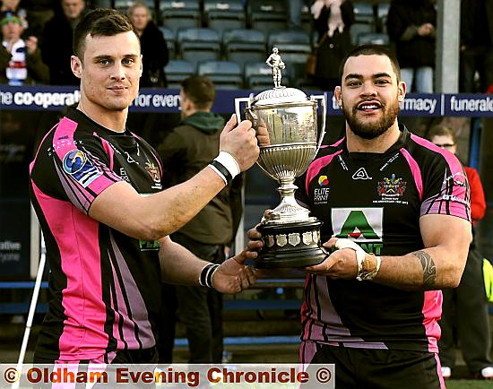 MISSION ACCOMPLISHED: delighted Oldham duo Lewis Palfrey and Sam Gee hold aloft the Law Cup. 
