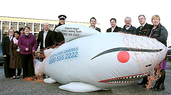 Sid the Shark, pictured with trading standards officers, police, councillors and members of the Illegal Money Lending Team, is on a mission 