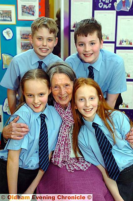 Head teacher Maureen Barnett retires from East Crompton St. James's School at the age of 80. Pic with some of her year 6 pupils, clockwise from back left, Matthew Taylor, Ben Pellowe-Hill, Milly Sikora, Georgia Taylor. 
DAM13-03-07/09A 

