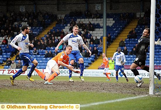 STOOPING TO CONQUER . . . Smith relegates Bury at Gigg Lane 