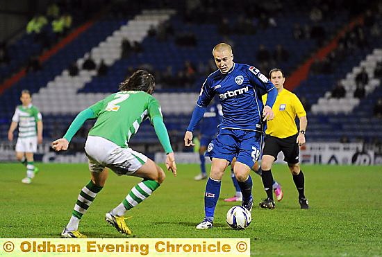 CONTRACT: Athletic midfielder David Mellor, in action against Yeovil last month, is staying at Boundary Park. 