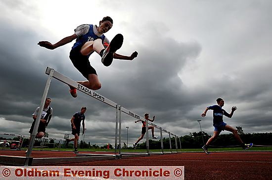 HIGH FLIER: Royton and Crompton’s Dane Taylor in action in the Year Eight boys’ hurdles final. 