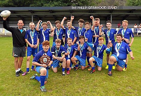 PURE JOY . . . Saddleworth School’s Year Nines team celebrate their Oldham Schools’ Cup success. 
