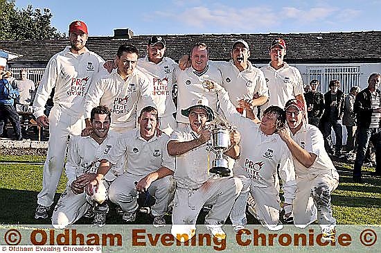 Uppermill’s players celebrate after claiming Tanner Cup glory. Uppermill’s players celebrate after claiming Tanner Cup glory.