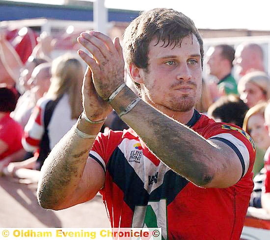 CAPTAIN MARVEL . . . star man Lewis Palfrey applauds the Oldham fans after his team’s thumping of London Skolars at Whitebank yesterday. 