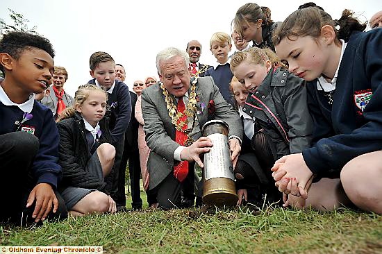 Peter King buries the time capsule
